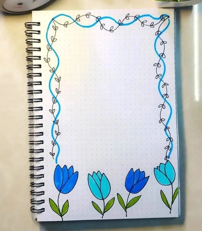 نقاشی گل کنار دفتر مشق